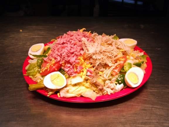 95 Crisp lettuce, topped with chili beans, fresh tomatoes, onions and lots of shredded cheese Mini Julienne 8.95 With Turkey and ham, lettuce, tomatoes, Shredded cheese, green peppers, onions & eggs.