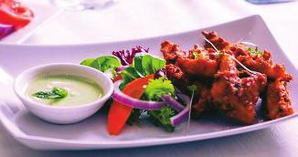 apple cider dressing Spiced cashews, moong sprouts, avocado, tomatoes, coconut cashew dressing Vegetable Appetizers Samosa (3pcs) Onion Bhaji or Vegetable pakora 6.