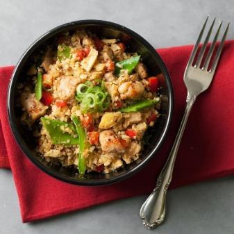 Cauliflower Chicken Fried "Rice" Makes 4 servings Total Time: 35 minutes 1 teaspoon peanut oil plus 2 tablespoons, divided 2 large eggs, beaten 3 scallions, thinly sliced, whites and greens separated