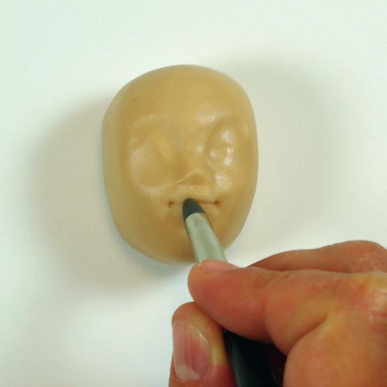 gumpaste and create indents for the eyeballs. 2.
