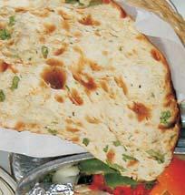 Tandoori rotiyan / Indian Breads Leavened bread baked in tandoor. White flour unleavened bread with spiced cottage cheese. Leavened bread enriched with butter and baked in tandoor.