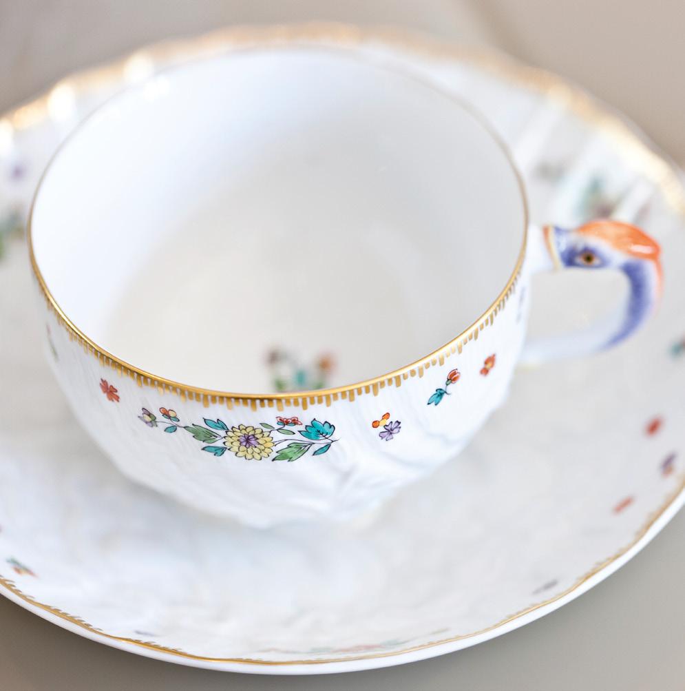 SWAN DESIGN INDIAN FLORAL BRANCH They look fragile, the small blossoms on the innocent white porcelain.