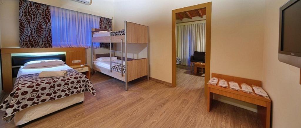 ROOMS LOCATION SPACE FEATURES FAMILY ROOM WITH BUNKBED Garden view 37m2 10 rooms.