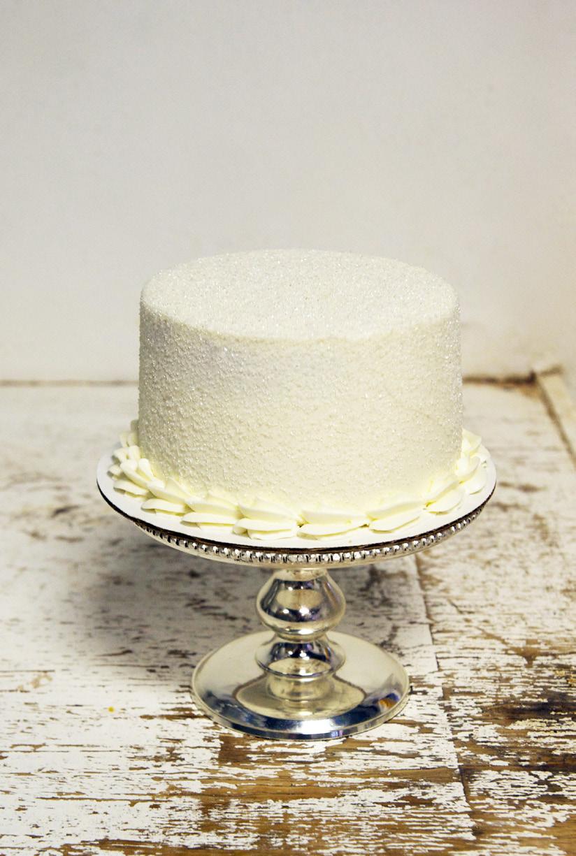 Featured: The White Wedding Classic wedding cake, with white cake and our signauture wedding frosting with a