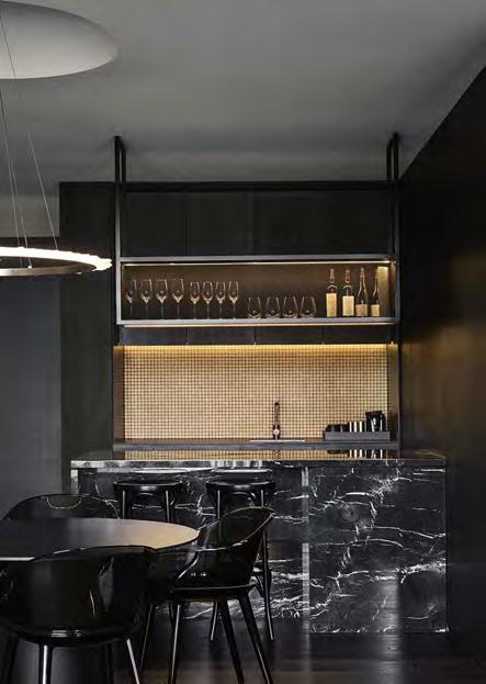 A daring crystal and copper Christopher Boots lighting installation illuminates the loft and compliments the colour, tone and form of the room