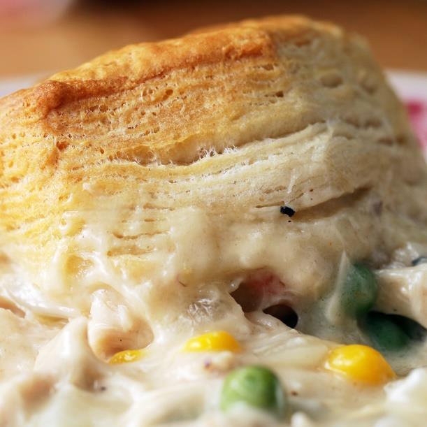 Chicken & Biscuit Bake 6 tablespoons butter 1 onion, chopped ½ cup flour (65 g) 3 cups chicken broth(710 ml) 1 teaspoon salt 1 teaspoon pepper 1 cup heavy cream(235 ml) 2 ½ cups frozen mixed