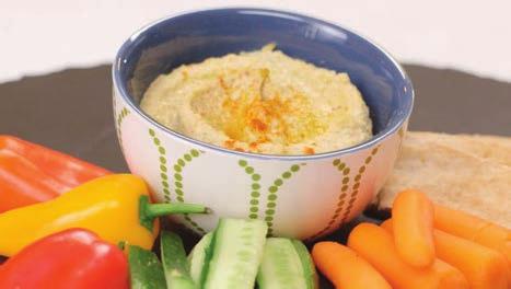 LIGHT AMERICAN PISTACHIO HUMMUS RECIPE BY SHARON PALMER, RDN 12 servings 1 can garbanzo beans, reserve liquid from can ½ cup shelled pistachios 2 cloves garlic 2 tablespoons tahini 1 teaspoon extra