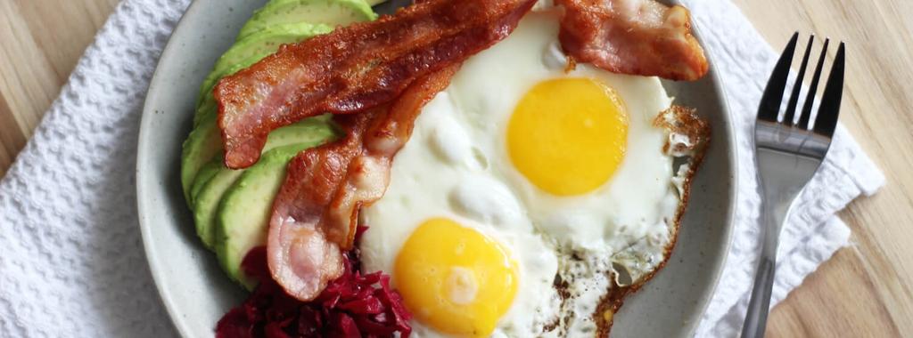 Bacon, Eggs, Avocado & Sauerkraut 4 ingredients 15 minutes 4 servings 1. In a pan, slowly cook the bacon over medium-low heat until done. Transfer to a plate and reserve fat for cooking eggs. 2.