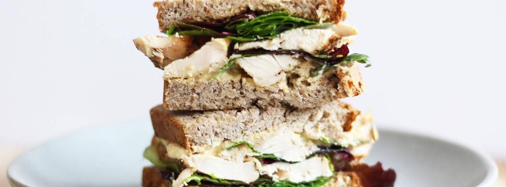 Turkey Hummus Sandwich 5 ingredients 5 minutes 4 servings 1. Lightly toast the bread. 2. Spread one slice of the bread with hummus and mustard. Layer on the turkey and mixed greens.