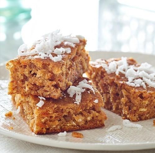 Carrot Cake ¾ cup self-rising flour ⅔ cup brown sugar 1 tbsp. cinnamon 2 carrots, peeled & cut into 3 chunks ½ fresh coconut, husk removed ½ cup pecans 2 eggs ½ cup vegetable oil 2 tbsp.