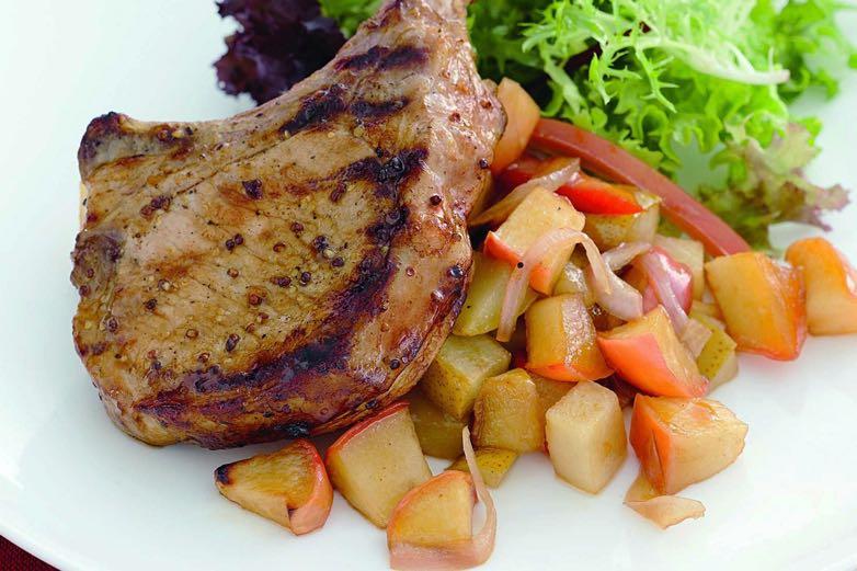 Grilled Pork and Apples In a medium-sized bowl, combine apples, onion, almonds, vinegar, rosemary, lemon juice, and salt and pepper to taste. Set aside. Sprinkle pork chops with salt and pepper.