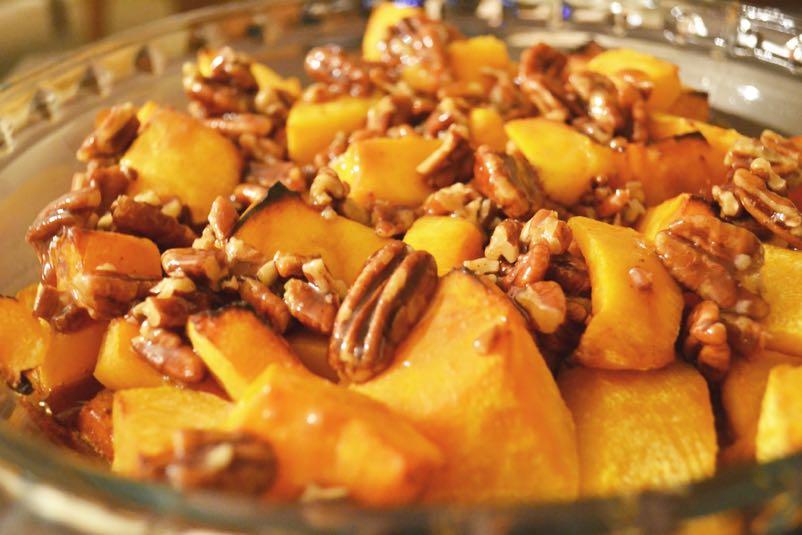 Butternut Squash and Pecans Preheat oven to 425 degrees F. Arrange butternut squash in a single layer on a rimmed baking sheet; coat with cooking spray. Sprinkle evenly with salt and pepper.
