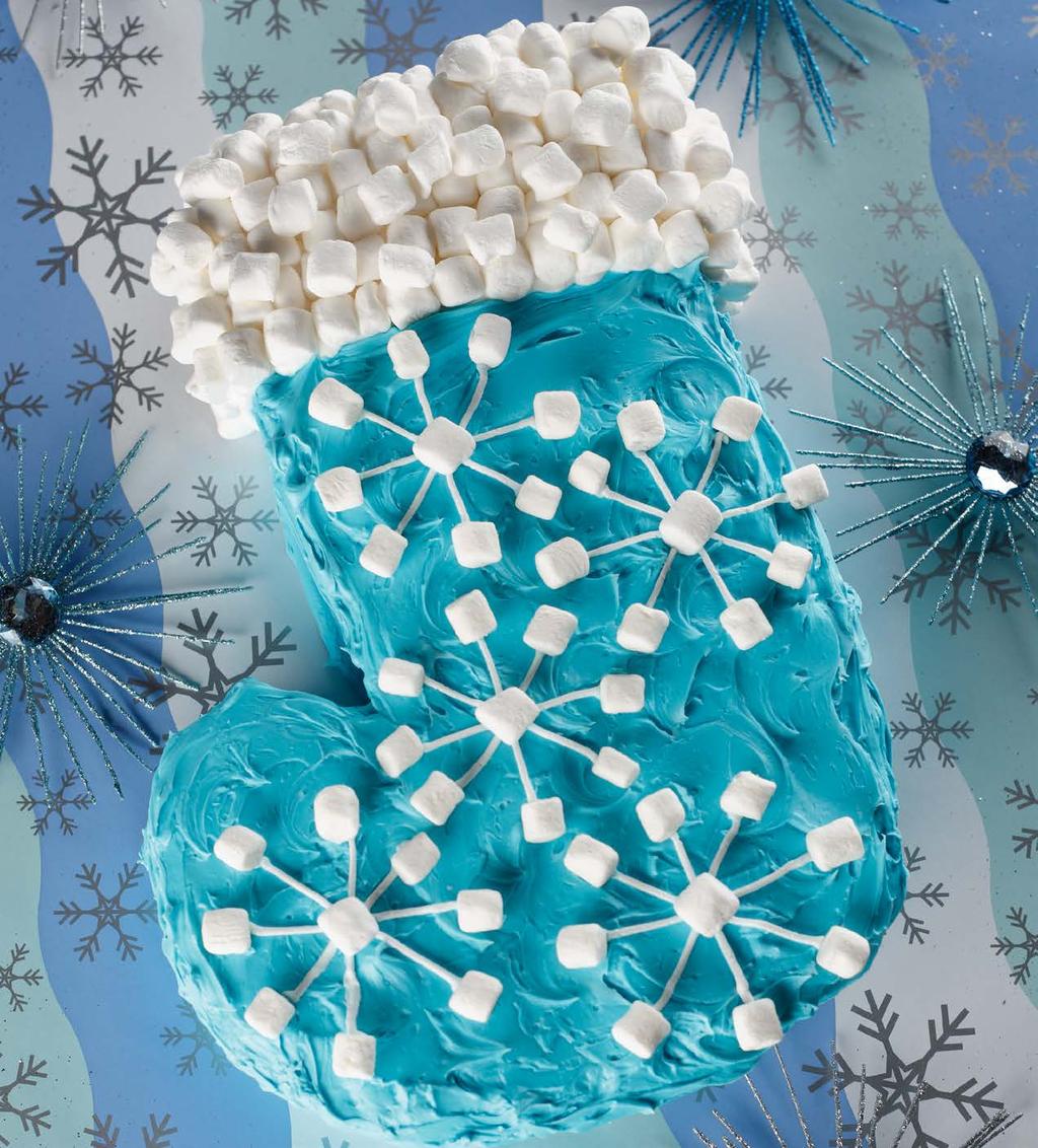 Snowflake Stocking Pan Frosting (page 14) or 1 (16-ounce) can white frosting, divided, 2 3 colored light blue and 1 3 left white Blue sprinkles, optional White miniature marshmallows Preheat oven to