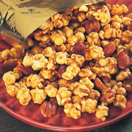 Whole pecans and almonds accent popcorn generously coated with rich, buttery