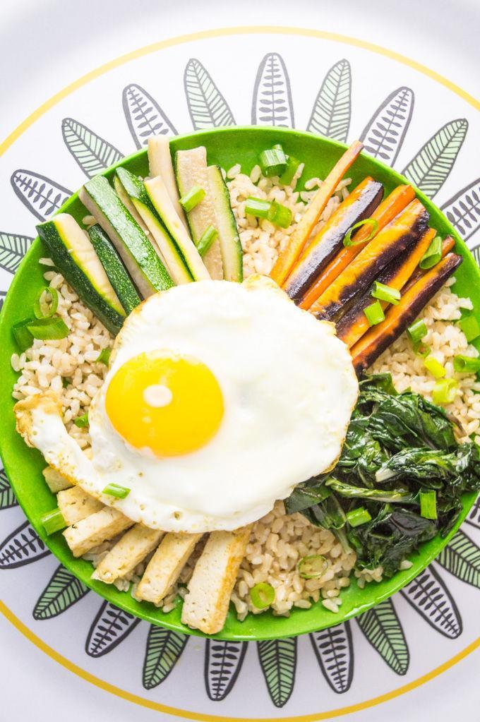 BIBIMBAP NOURISHING BOWL Adapted from My Gut Feeling, Serves 2 ½ cup brown or white rice 1 cup water Pinch of salt 1 cup baby spinach, chopped 1 medium rainbow carrot, peeled and julienned 1 medium