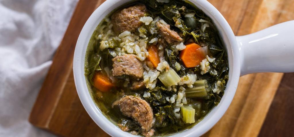 4 HOURS Pork Sausage (cut into chunks) Yellow Onion (medium, diced) Carrot (medium, diced) Celery (diced) Kale Leaves (chopped) Water (or broth) Sea Salt Brown Rice (dry, uncooked) Add all
