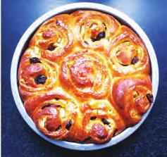 ..... (b) The picture below shows some Chelsea buns made using an enriched yeast mixture.