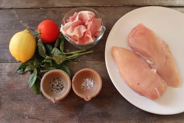 Place the chicken on the tray. Top with the tomato, basil and sliced ham. Add the lemon juice and salt and pepper.