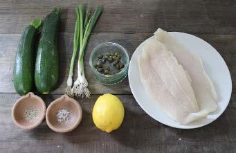coconut oil in a frying pan. Add the fish and cook over a medium-low heat for 20 minutes, turning halfway. When cooked, the flesh will be opaque and should flake easily.