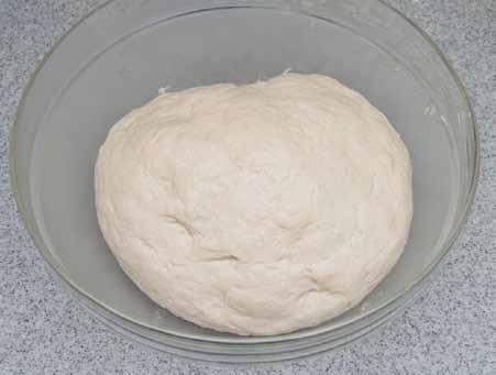 As you can see, the dough came back together again after adding the butter. I use the same mixing bowl, after washing it out, and coat it with butter.