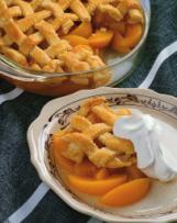 PEACH COBBLER Sage Morris, Guernsey 4-H Two 29-oz cans yellow peaches in heavy syrup 1 white cake mix 2 sticks melted butter ½ tsp cinnamon Preheat oven to 375.