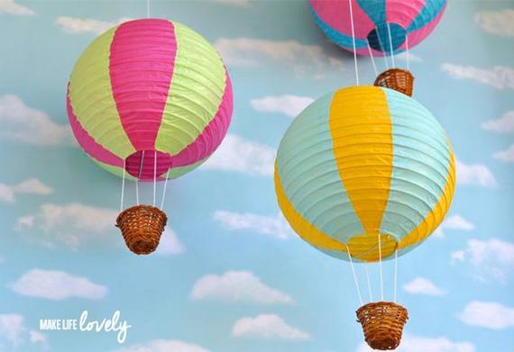 Instructions: Take a paper lamp and paste 4 threads on the bottom to hang a small basket. Paste a thread on the top to hang the hot air balloon.