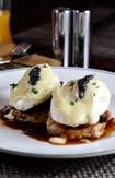 THE HENRY American Cuisine Signature: Short rib benedict braised short ribs, hollandaise, crispy potato cakes topped with caviar At The Henry, old school masculinity puts a sophisticated twist on
