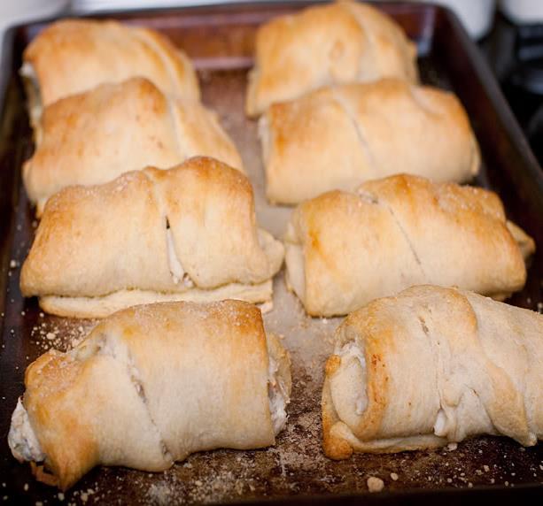 Chicken Roll Ups 1. 12 oz cream cheese 2. 2 cups chopped cooked chicken 3. 2 tbs milk 4. 1 can crescent rolls 5. 1 tbs grated onion 6. 1/4 cups melted butter 1. Preheat oven to 350 degrees F. 2. In a large bowl, mix softened cream cheese and milk until smooth.