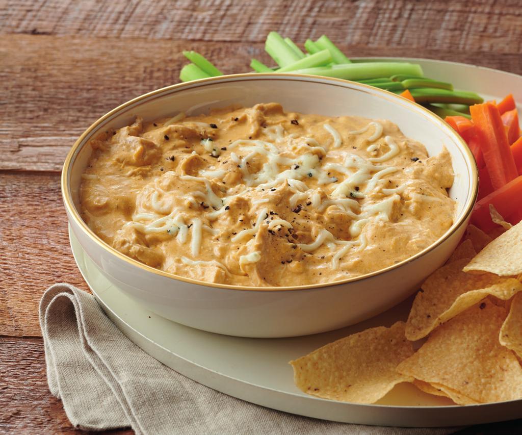 Buffalo CHICKEN DIP 8-10 10 minutes 2 hours 1 whole rotisserie chicken, meat picked off bones (about 2 lbs.) 5 oz. ranch dressing 16 oz.