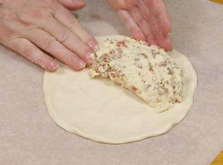 8 6 Roll the dough into a flat circle and press some of the filling
