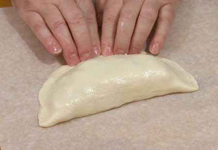 9 Pull the uncovered half of the dough over the filling and press the