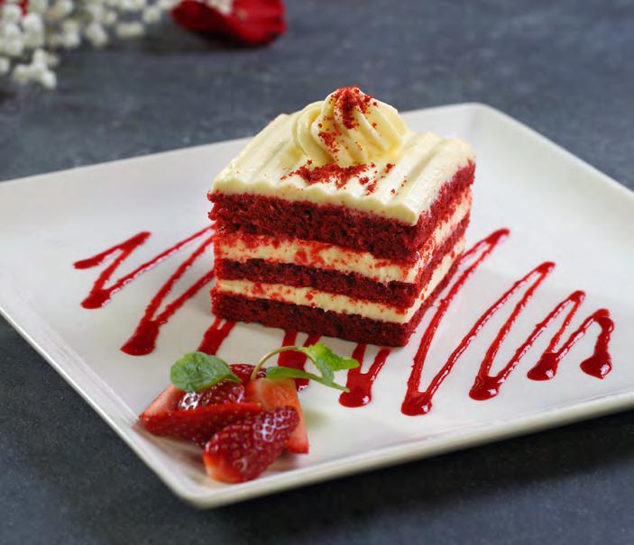 Red Velvet Cake Our classic Red Velvet Cake features three layers of dark cocoa-rich sponge cake with smooth frosting concocted