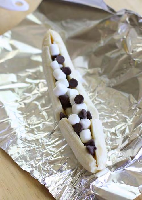 Wrap it in foil and throw it on a grill for a couple of minutes to get a warm, decadent banana melt.