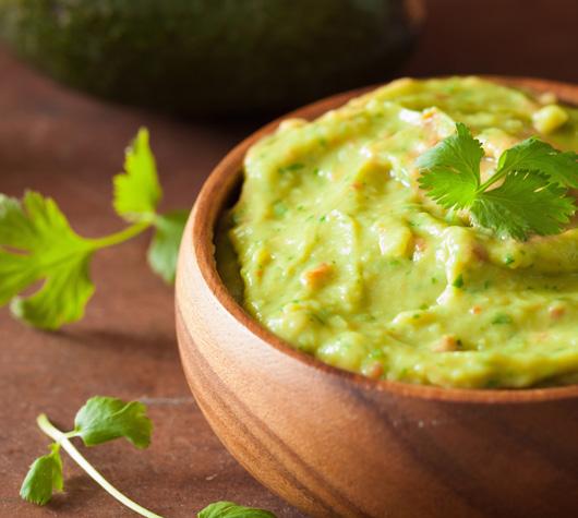 CILANTRO GUACOMOLE DIP 16 3 avocados - peeled, pitted, and mashed 1 lime, juiced 1 teaspoon salt 1/2 cup diced onion 3 tablespoons chopped fresh cilantro 2 roma (plum) tomatoes, diced 1 teaspoon