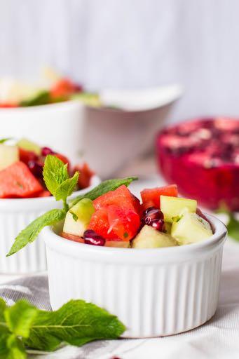 Sweet Red and Green Fruit Salad Melon meets cucumber meets pomegranate meets mint.