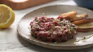 Beef Tartare 1 Serving Ingredients 3 day old baguette slices Salt and pepper to taste 1 raw yolk 1/4 lb. Beef, eye of round (whole) 1 tsp. Dijon Mustard 1 tsp.