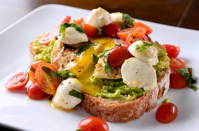 Italian Caprese Avocado Toast (makes 4 servings) 1 pint cherry tomatoes (halved) ¼ cup basil (finely sliced) plus more to garnish if desired 4 slices whole-grain or whole-wheat bread 1 avocado,