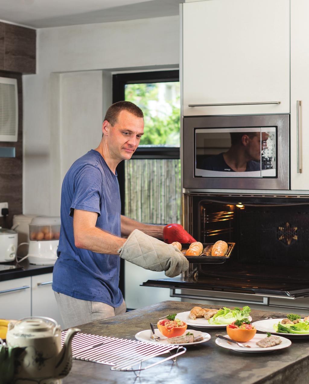 Work and life Cooking Gilles Alexandre Salansy takes freshly baked baguettes out of the oven to compliment his French