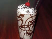 99 Pint Glass Sundae First we drizzle hot caramel and chocolate fudge in a frosted pint glass.