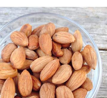 SNACKS Sprouted Almonds [Makes 2 Cups] 1 cup raw almonds sea salt to taste water 1. Add almonds to a glass container and about 3 cups of water, note the almonds will double in size.