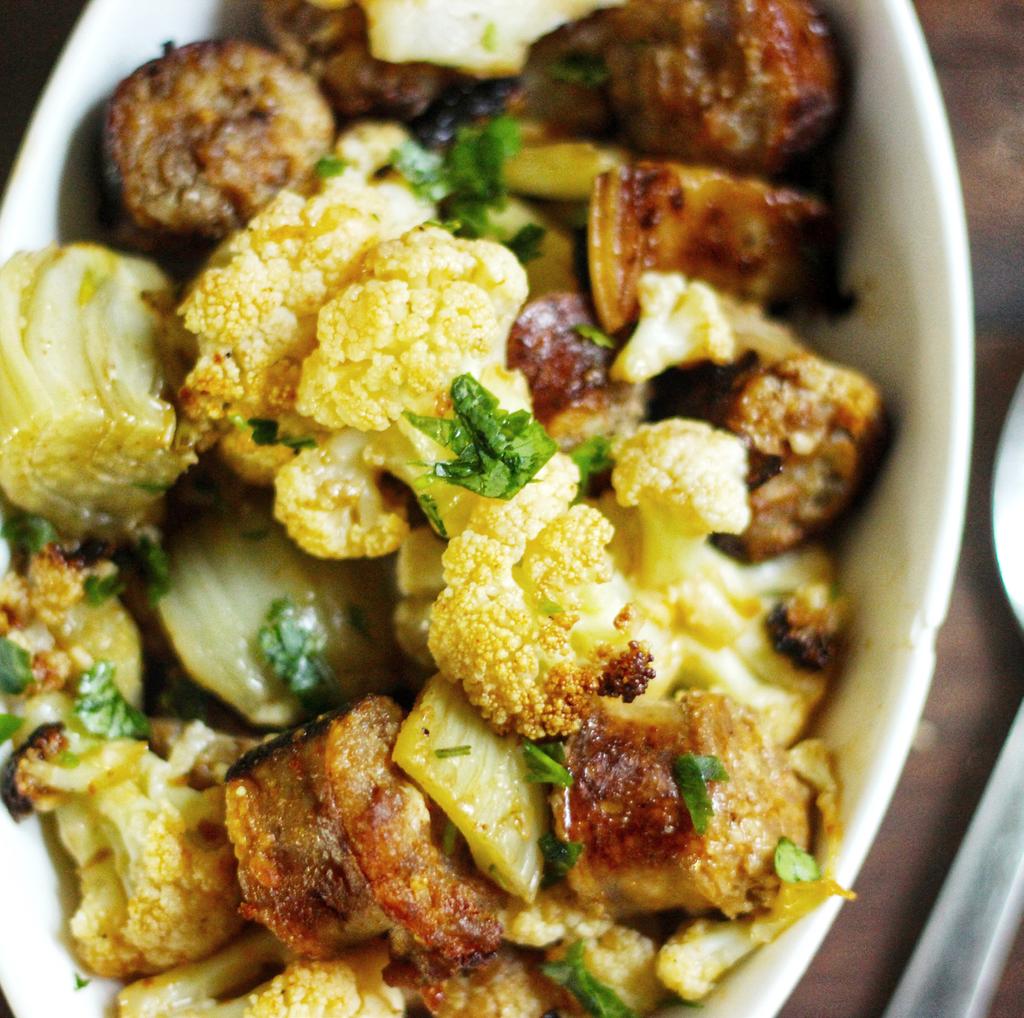 Slice sausage into discs. Melt coconut oil. 3. In a bowl, toss the cauliflower, fennel, and sausage with the garlic, melted fat, sea salt, and paprika. 4.