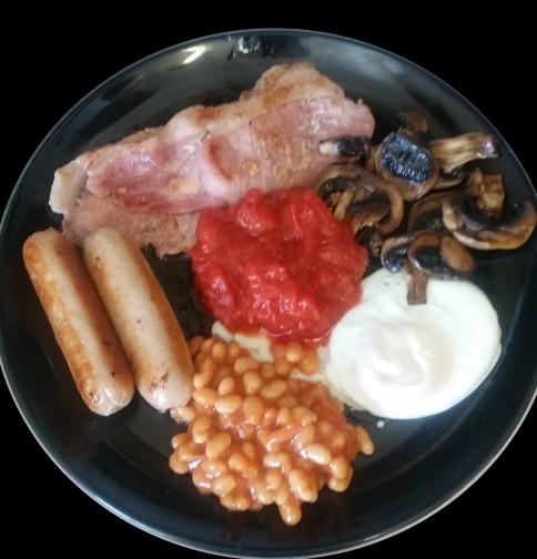 REGULAR BREAKFAST - 4.50 2 bacon, 2 sausages, fried egg, baked beans, chopped tomatoes, mushrooms, 2 toast or bread and butter. Cup of tea or instant coffee. LARGE BREAKFAST - 5.