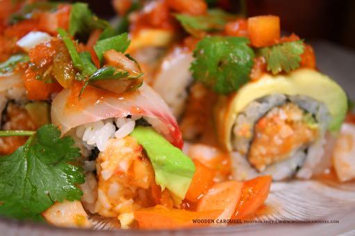 49 shrimp, crabmeat, avocado, cucumber, gobo, asparagus, and radish sprouts 10.Spicy Rain Tuna Roll 12.