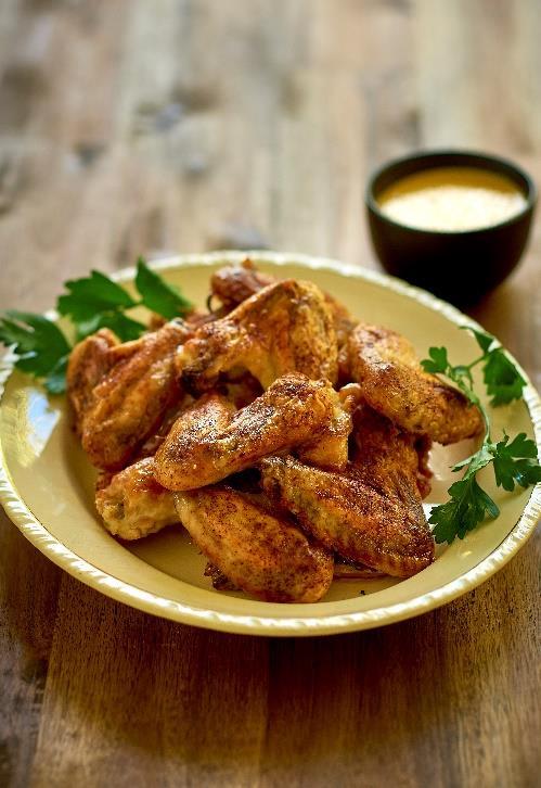 CRISPY CHICKEN 1½ kg of chicken wings or pieces 1 tbsp paprika Salt 70 g coconut oil and melted butter (½ each) 1. Preheat oven to 170 C (190 C if the oven is not fan forced).