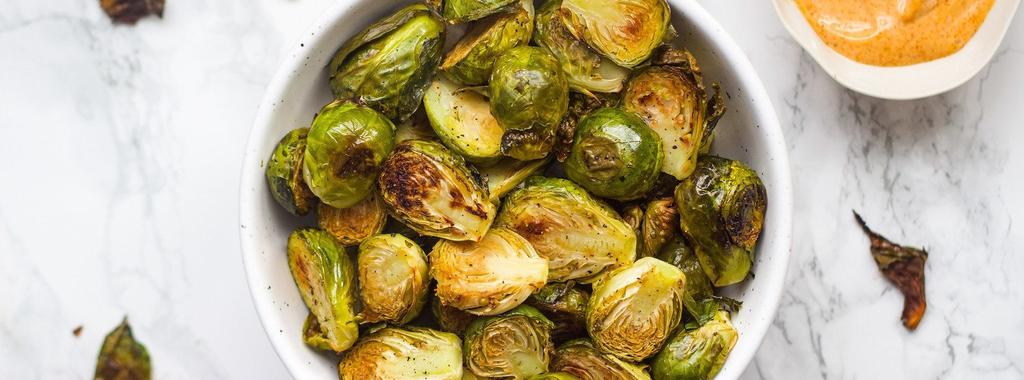 Crispy Brussels Sprouts with Dip 6 ingredients 35 minutes 4 servings 1. Preheat your oven to 425ºF (218ºC). Line a baking sheet with parchment paper and add the brussels sprouts.