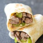 DAY 4 SMALLER FAMILY- PHILLY CHEESESTEAK WRAP M A I N D I S H Serves: 4 Prep Time: 10 Minutes Cook Time: 20 Minutes 1 onion 1 green bell pepper 2 Tablespoons olive oil 1/2 teaspoon salt 1/2 teaspoon