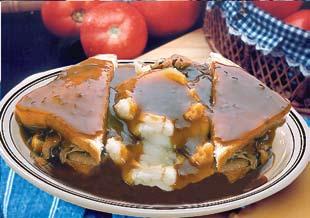 59 Hot Pork Manhattan Tender slices of pork served Manhattan-style on bread with mashed potatoes covered in gravy - 8.