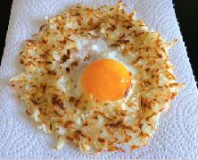 Egg in a Nest Cooking Time 20 mins 1 Egg 1 Potato, grated Coconut oil, just a few drops Salt to Taste Pepper to Taste 1. Take grated potato and squeeze out water by pressing between palms.