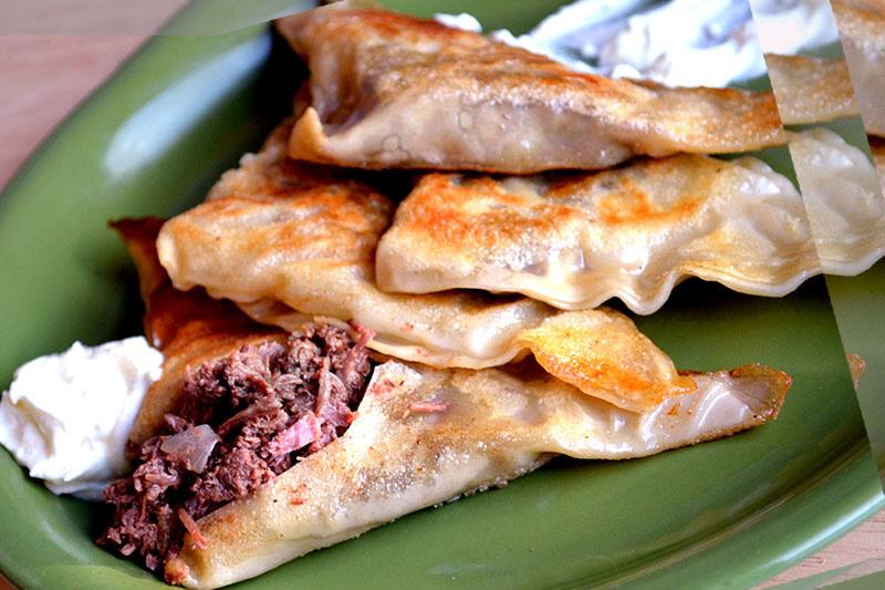 Meredith's BEEF PIEROGIS Time 30 Min Serves 8 1 can (28 oz) Keystone Beef 1 large onion, diced Salt and pepper to taste 2 Tbsp olive oil 2 packs wonton wrappers 2 large egg 2 Tbsp water Cook onion in