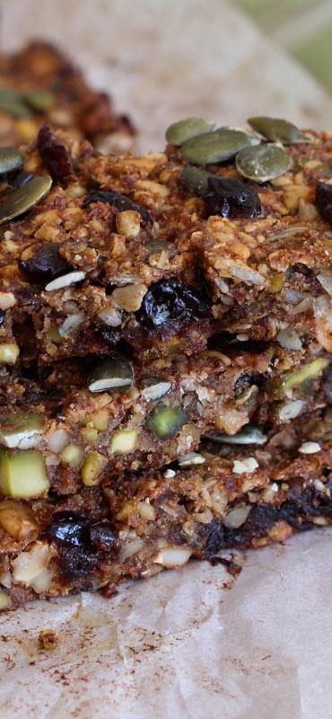 Cranberry Quinoa Bars (Original recipe from onegreenplanet) ½ cup uncooked quinoa 1 cup crushed almonds ¼ cup pumpkin seeds ¼ cup sunflower seeds 1 cup dried cranberries 2 Tbsp maple syrup 2 Tbsp
